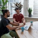 An account manager reviewing plans with a client.